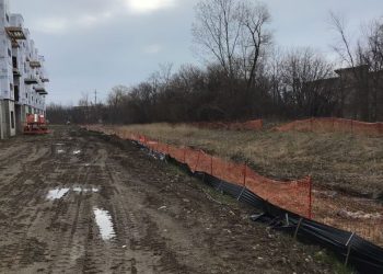 a train traveling down a dirt road